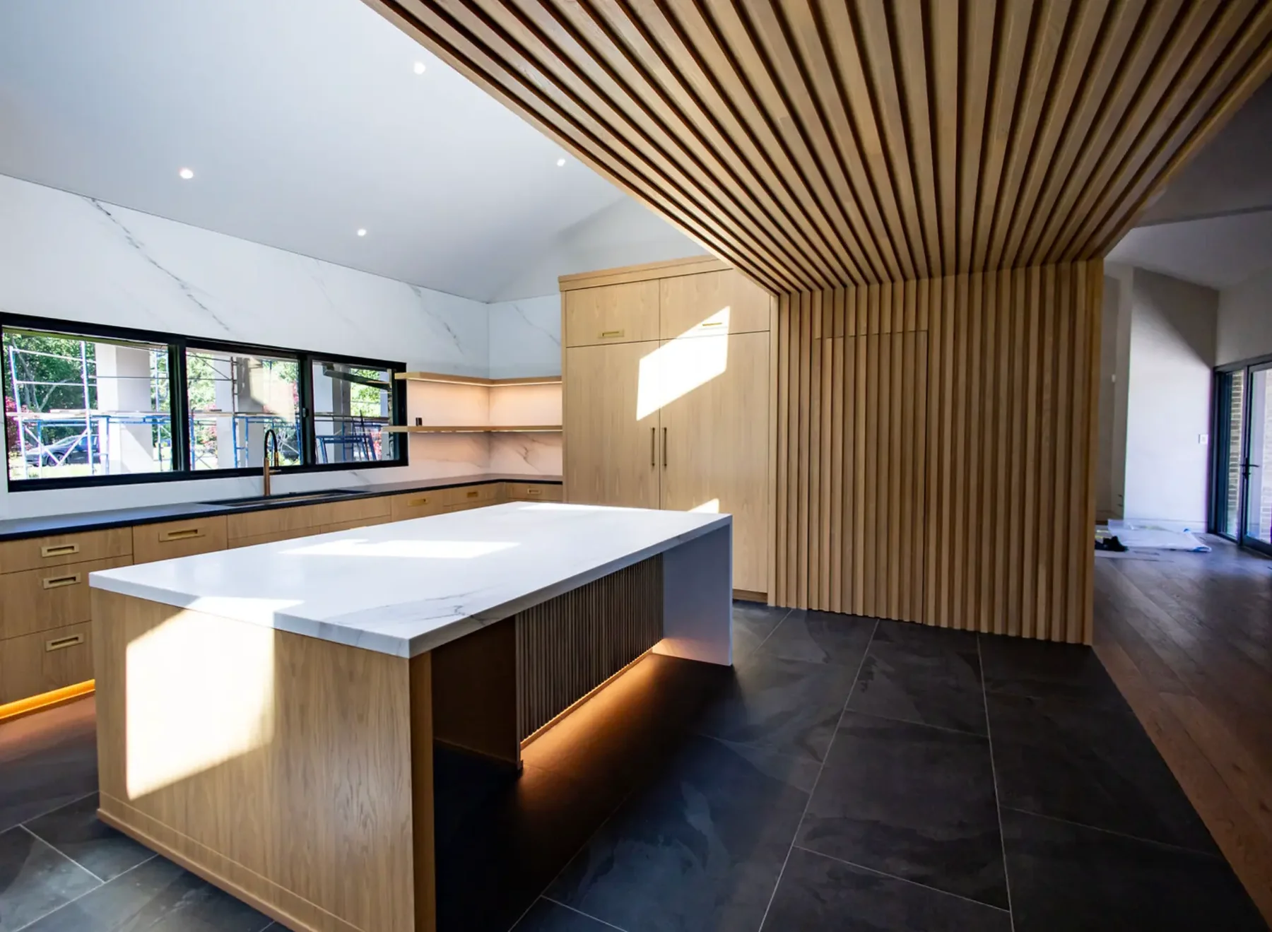 Kitchen with slat wood ceiling and stained oak cabinetry in Pompton Plains, NJ
