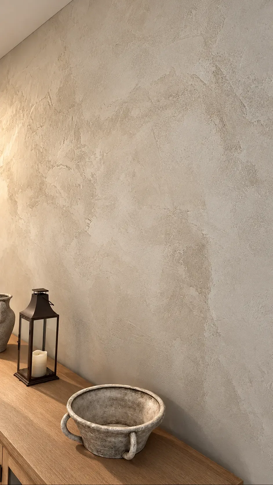 Close-up of the finished plaster texture beside a black lantern and rustic bowl — Ridgewood, NJ