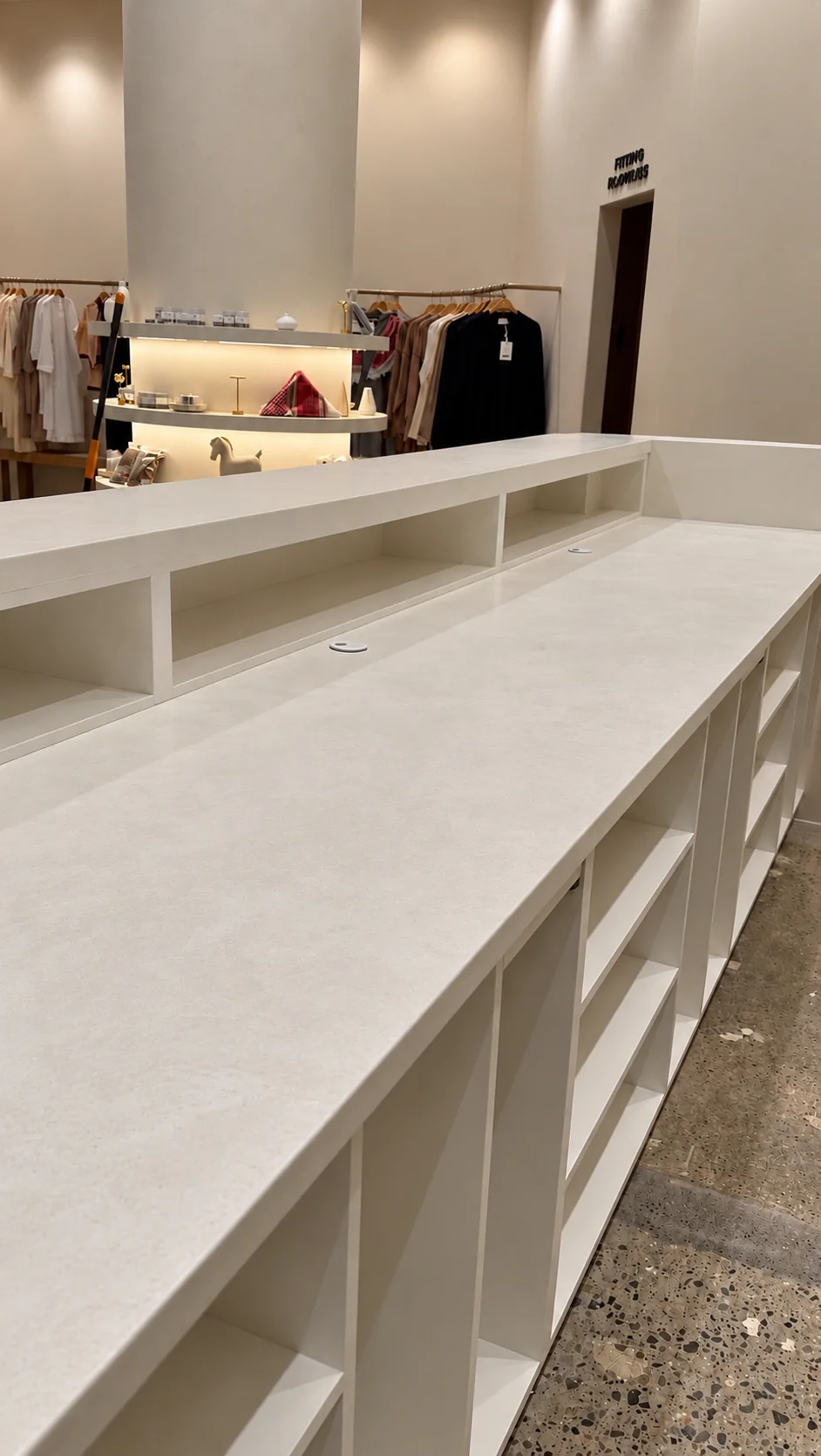 Smooth microcement counter top over open display shelving in the VEILED retail showroom in Clifton, NJ