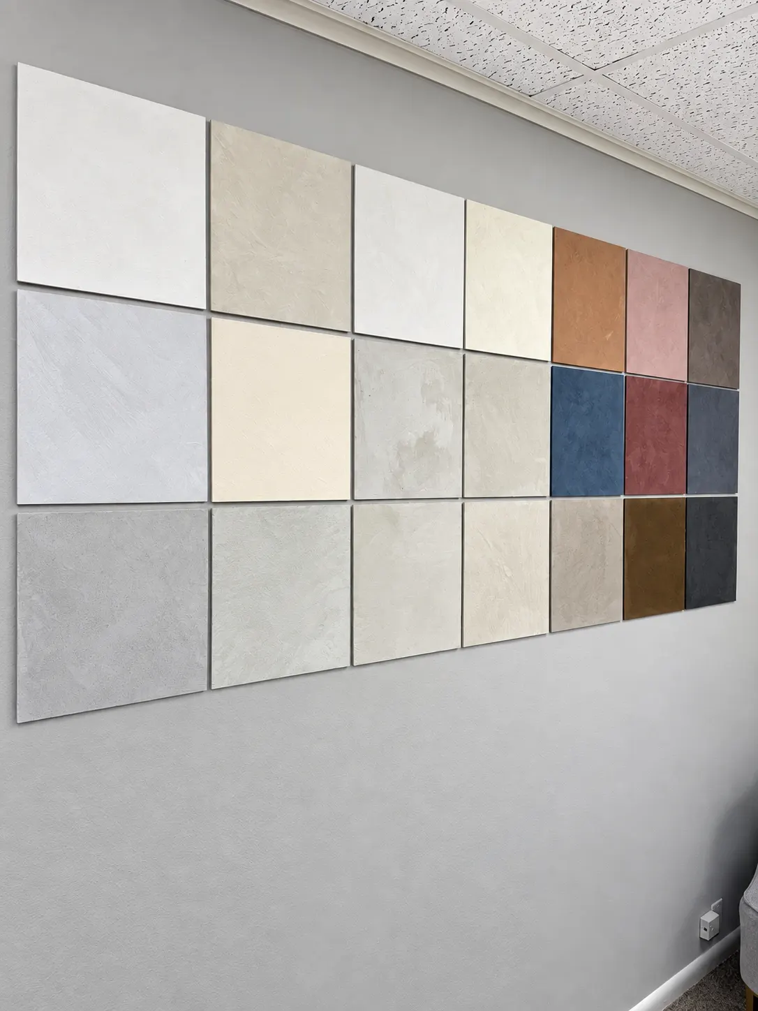 Limewash color sample wall with 21 hand-finished boards in neutrals, terracotta, blush, blue and charcoal at the All Time Paint & Plaster Co. office, 1581 Route 23 S, Suite 1, Wayne, NJ 07470