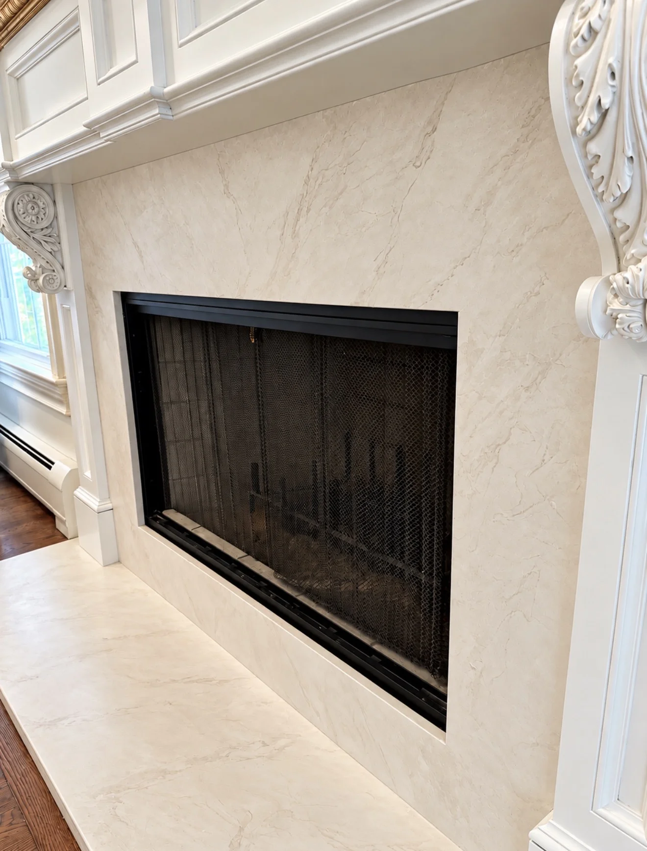 Marble fireplace surround resurfaced in Venetian plaster in a Franklin Lakes NJ living room