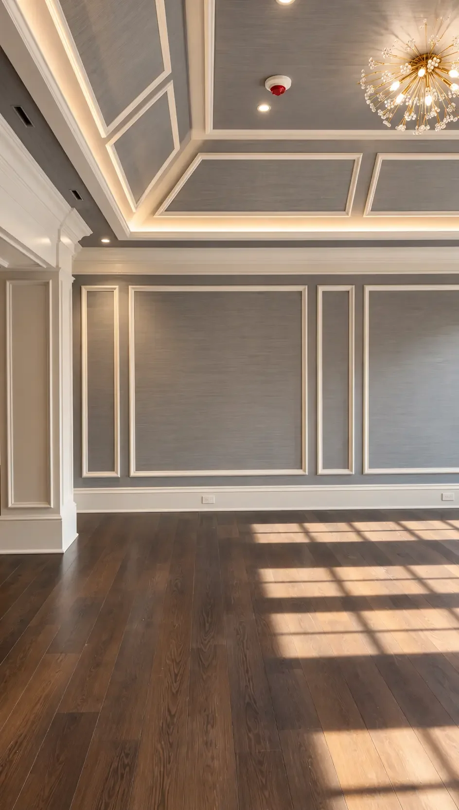 Gray grasscloth wallpaper set in painted wall panels in Alpine, NJ