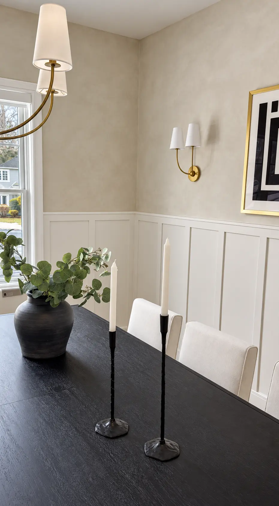 Dining room with warm neutral limewash walls above white board-and-batten wainscoting