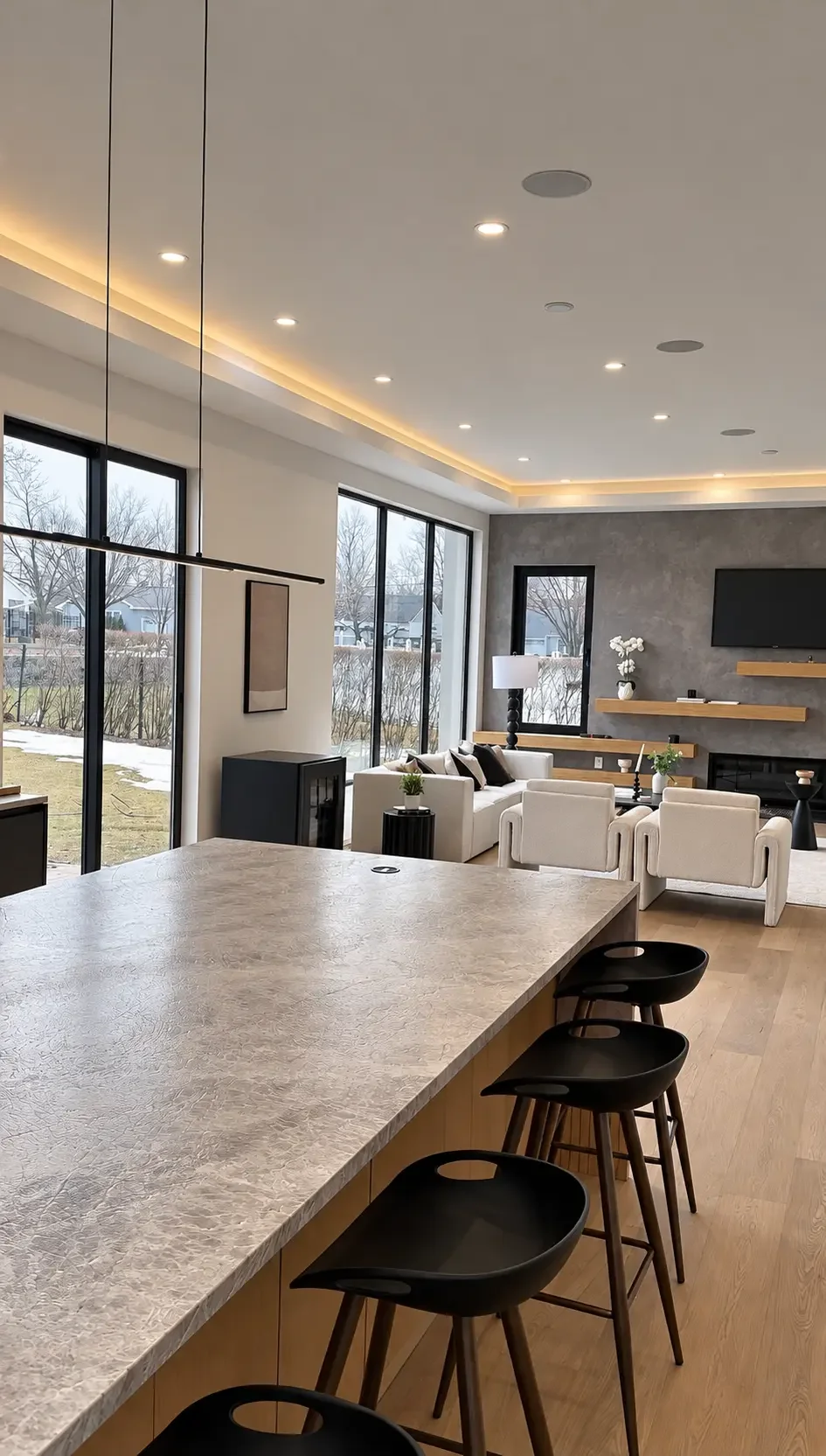 Stone kitchen island looking toward the Venetian plaster fireplace wall in Paramus, NJ
