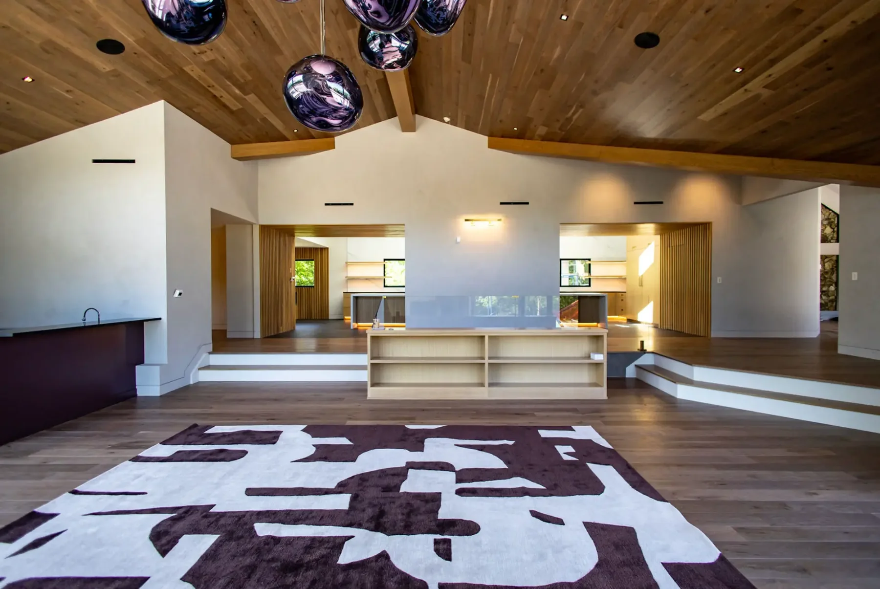 Great room with wood plank ceiling, beams and stained millwork in Pompton Plains, NJ