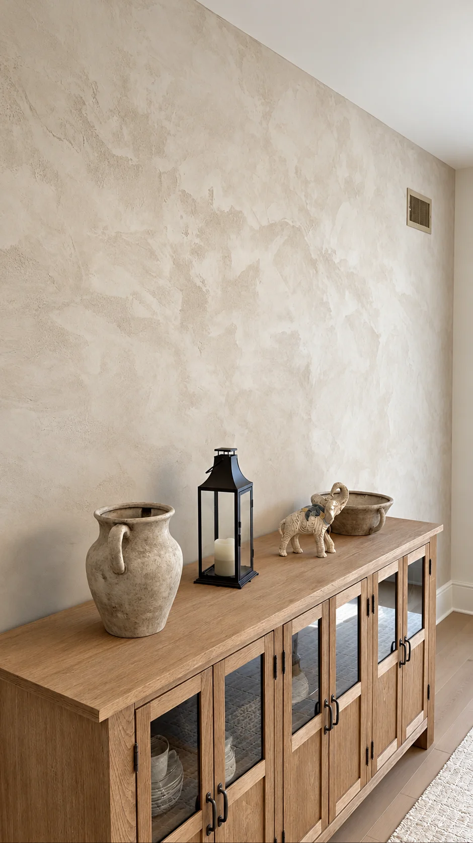 Closer view of the sandy plaster movement above the dining room sideboard — Ridgewood, NJ