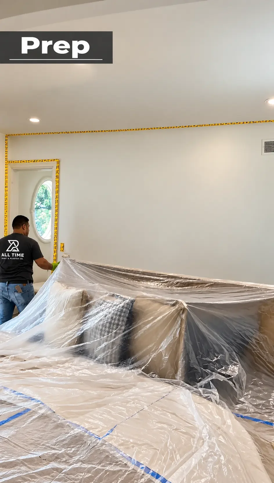 Crew member protecting bedroom furniture and floors with plastic and masking tape — Ridgewood, NJ