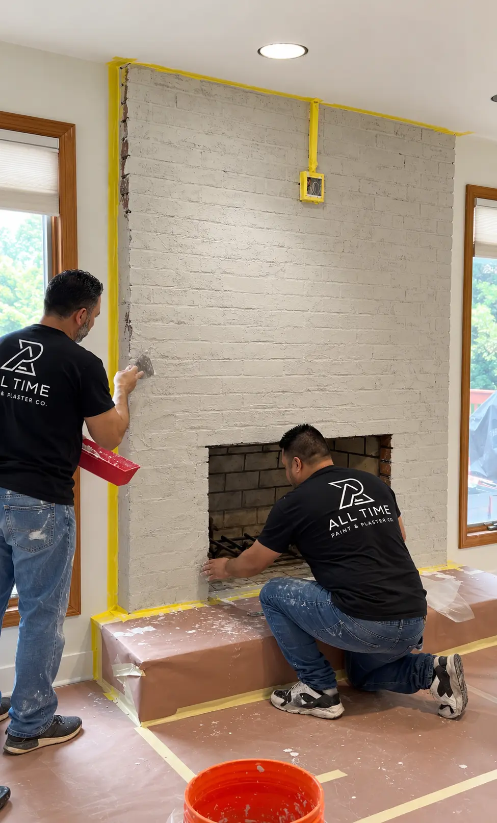All Time Paint & Plaster crew filling brick joints on a fireplace in Wayne New Jersey