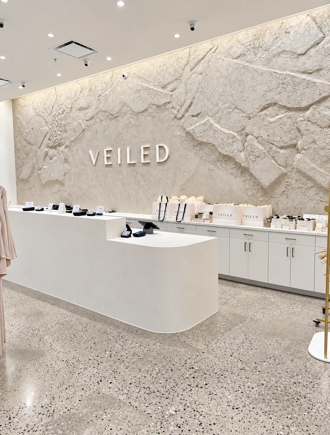 Finished seamless microcement checkout counter at the Veiled flagship store in Clifton, NJ
