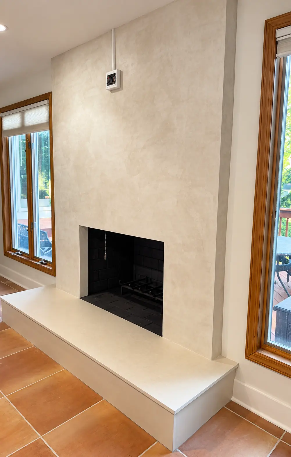 Hand applied Palladino decorative plaster fireplace finish, right angle view in Wayne NJ