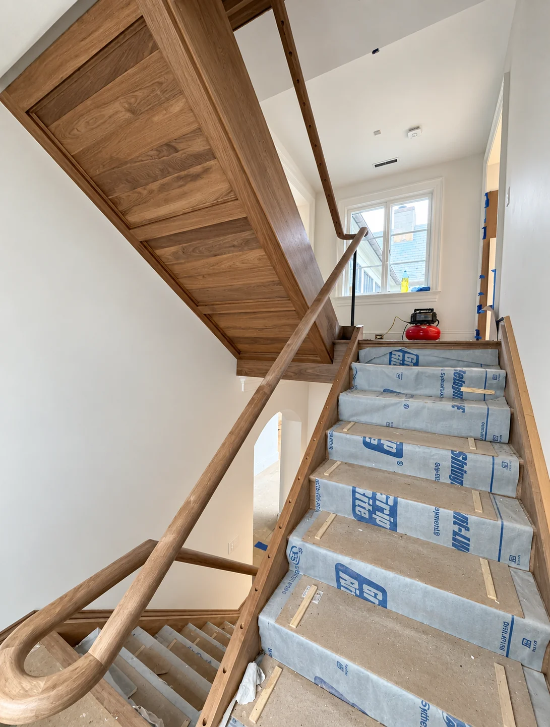 Staircase protected during new construction painting in Haworth, NJ